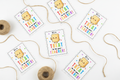 It's a TREAT to Be Your Teacher printable gift tags flat lay with twine spools on white background