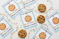 Smart Cookie printable gift tags flat lay with real chocolate chip cookies, star confetti, and twine